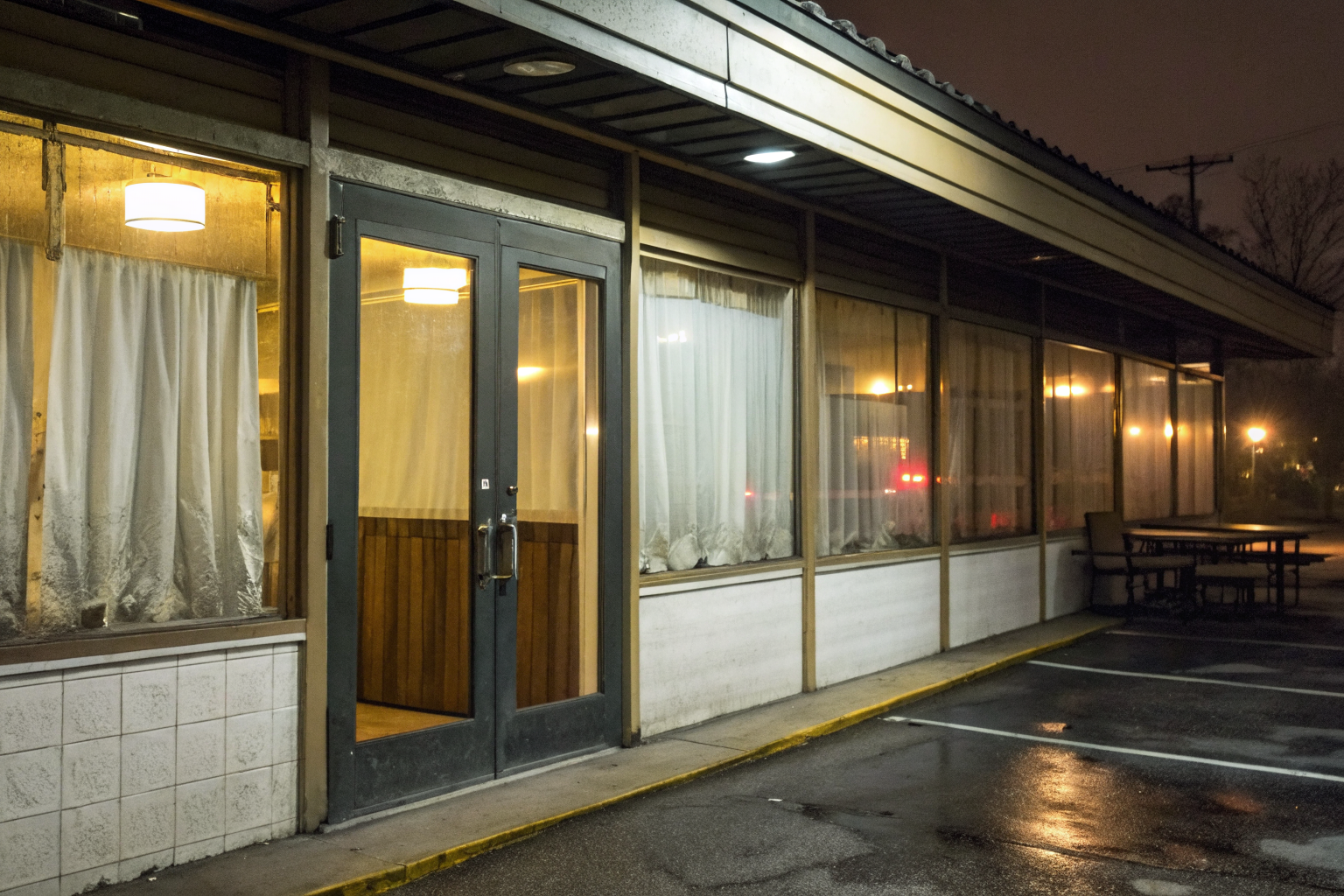 Restaurant with 'Closed by Health Department' sign on door.